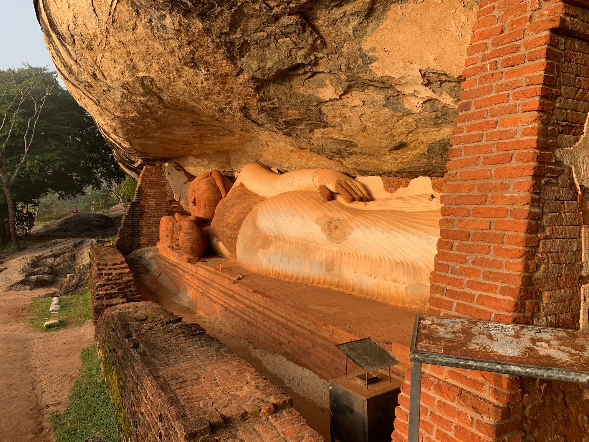 The reclining Buddha statue located halfway to the summit of Pidurangala Rock, Sri Lanka.