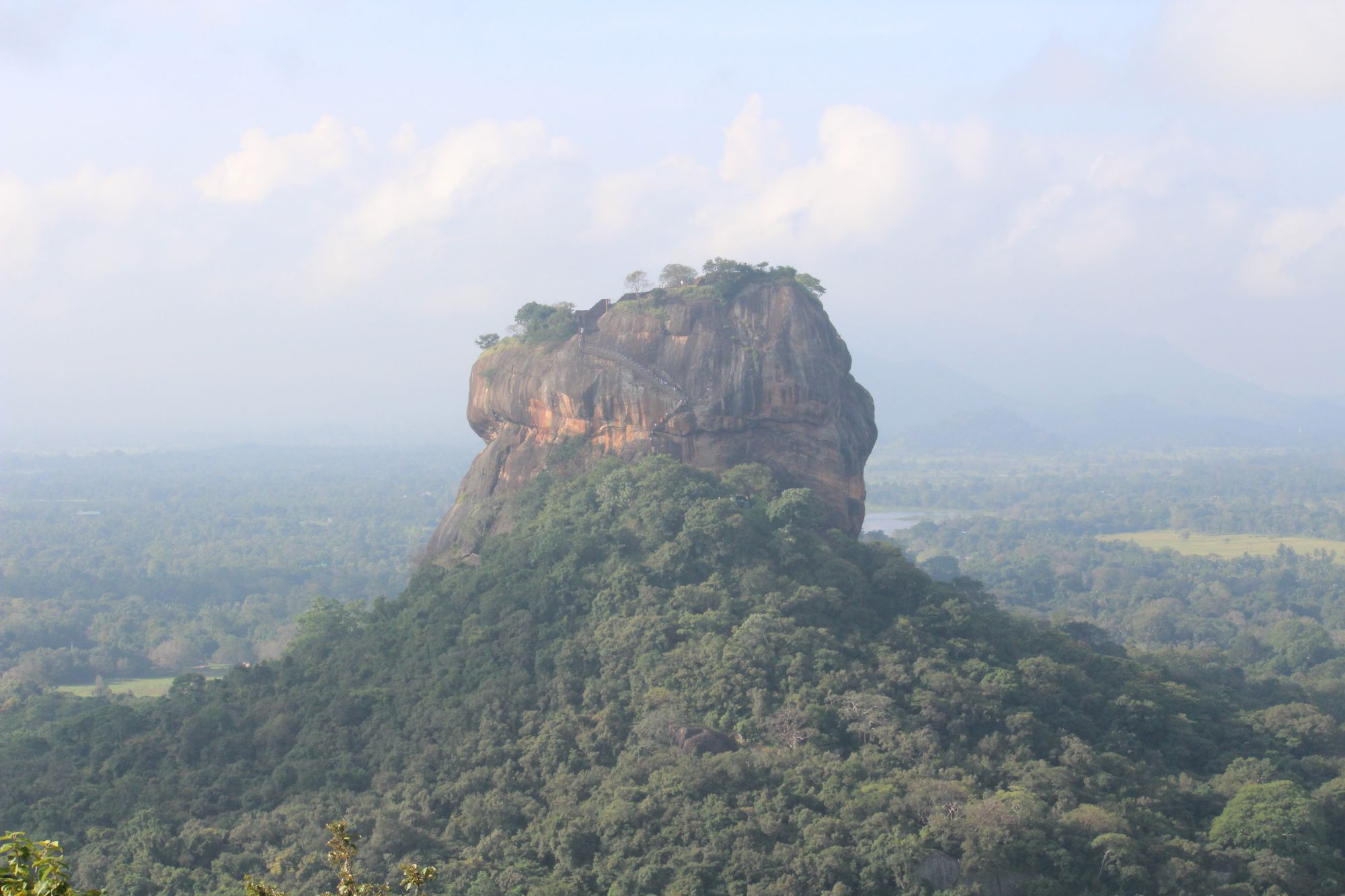 Sigiriya Rock Fortress seen from Pidurangala Rock with the surround area of Dambulla, Sri Lanka.