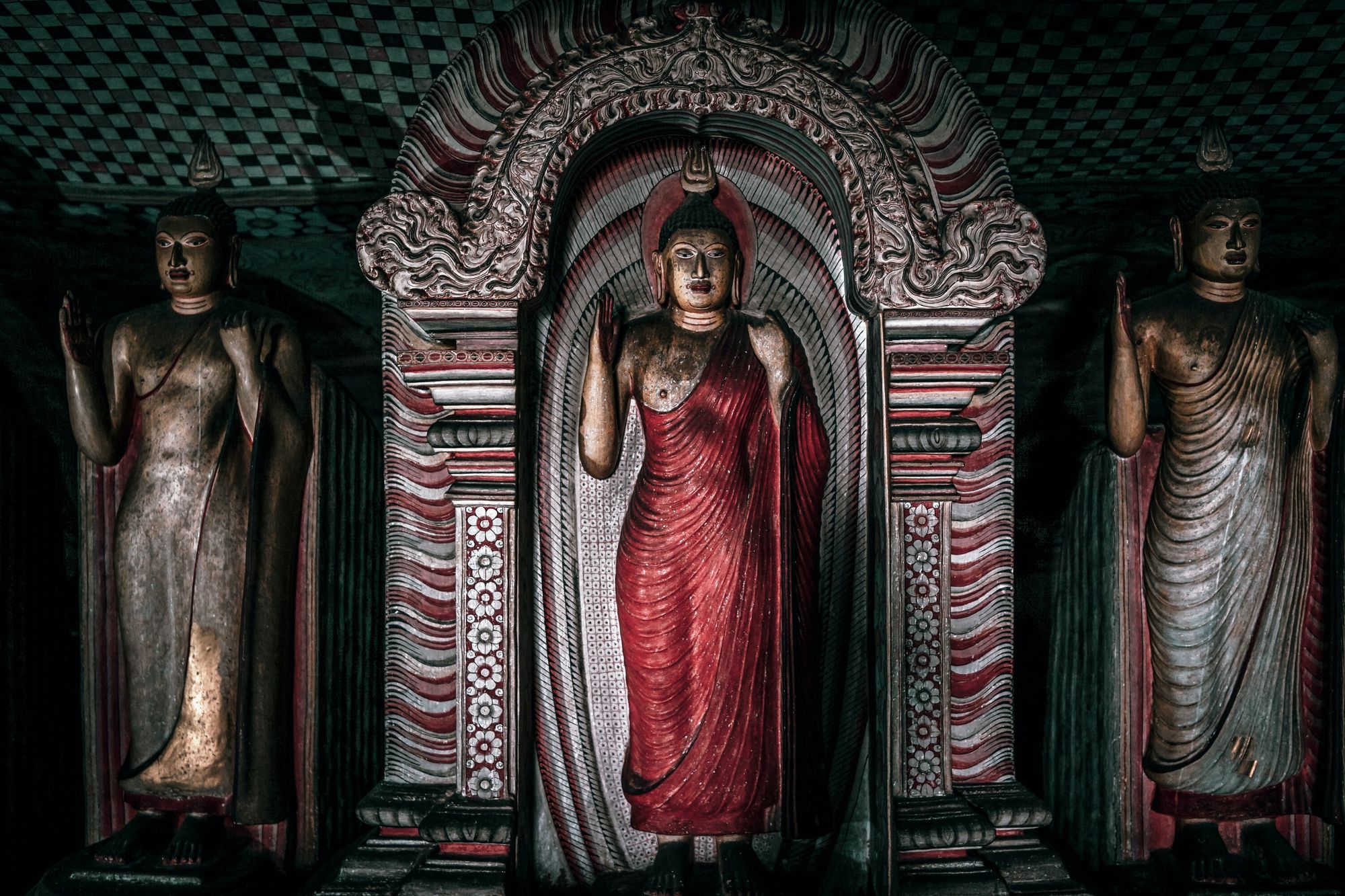 Buddha statues and paintings inside the Dambulla Cave Temple, Sri Lanka.