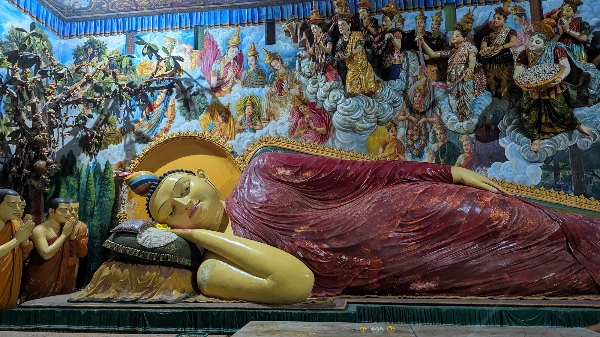 The reclining Buddha statue at the Angurukaramulla Temple in Negombo, Sri Lanka