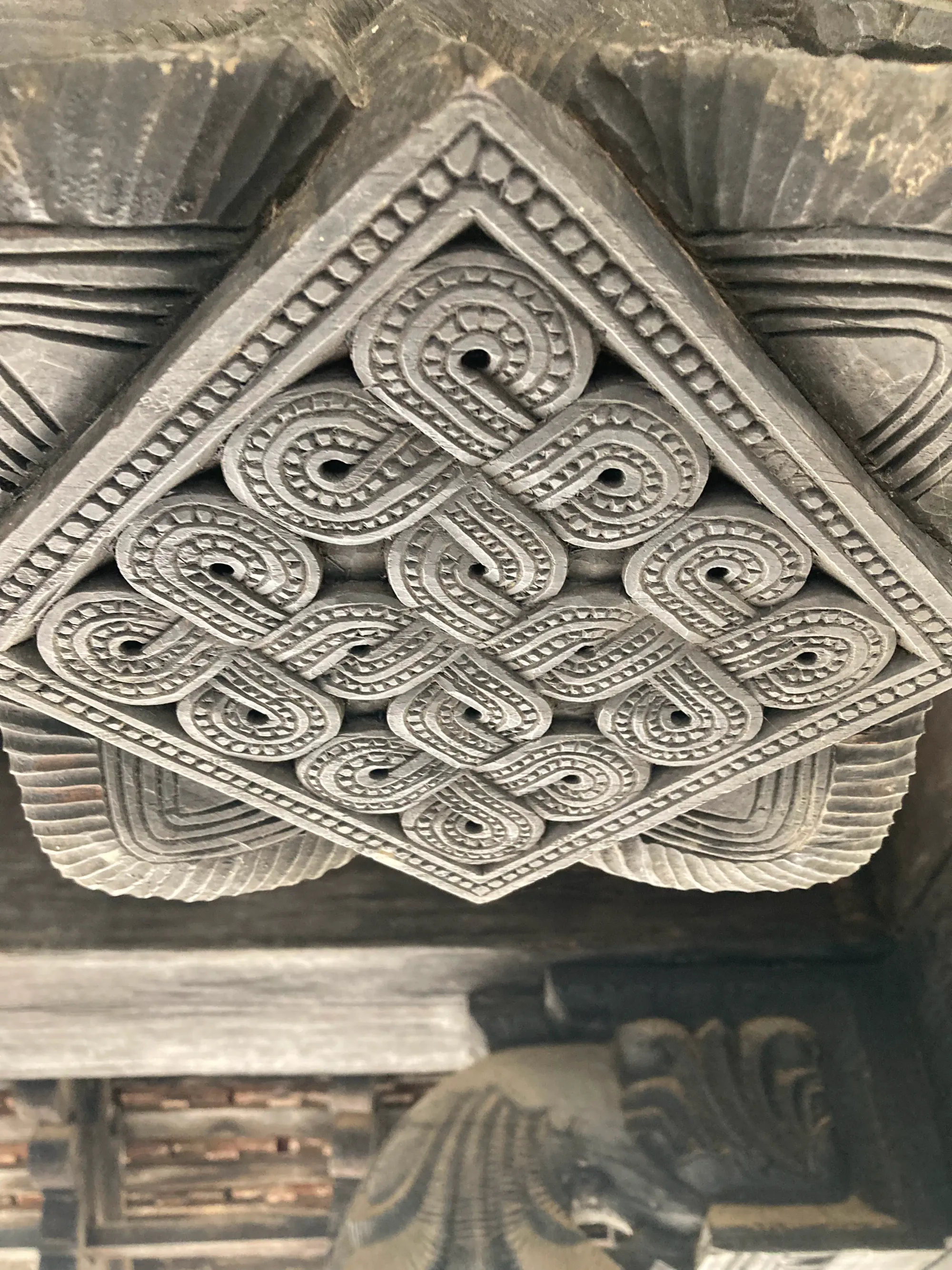 An interlacing design pattern carved from wood at Embekka Devalaya, Sri Lanka