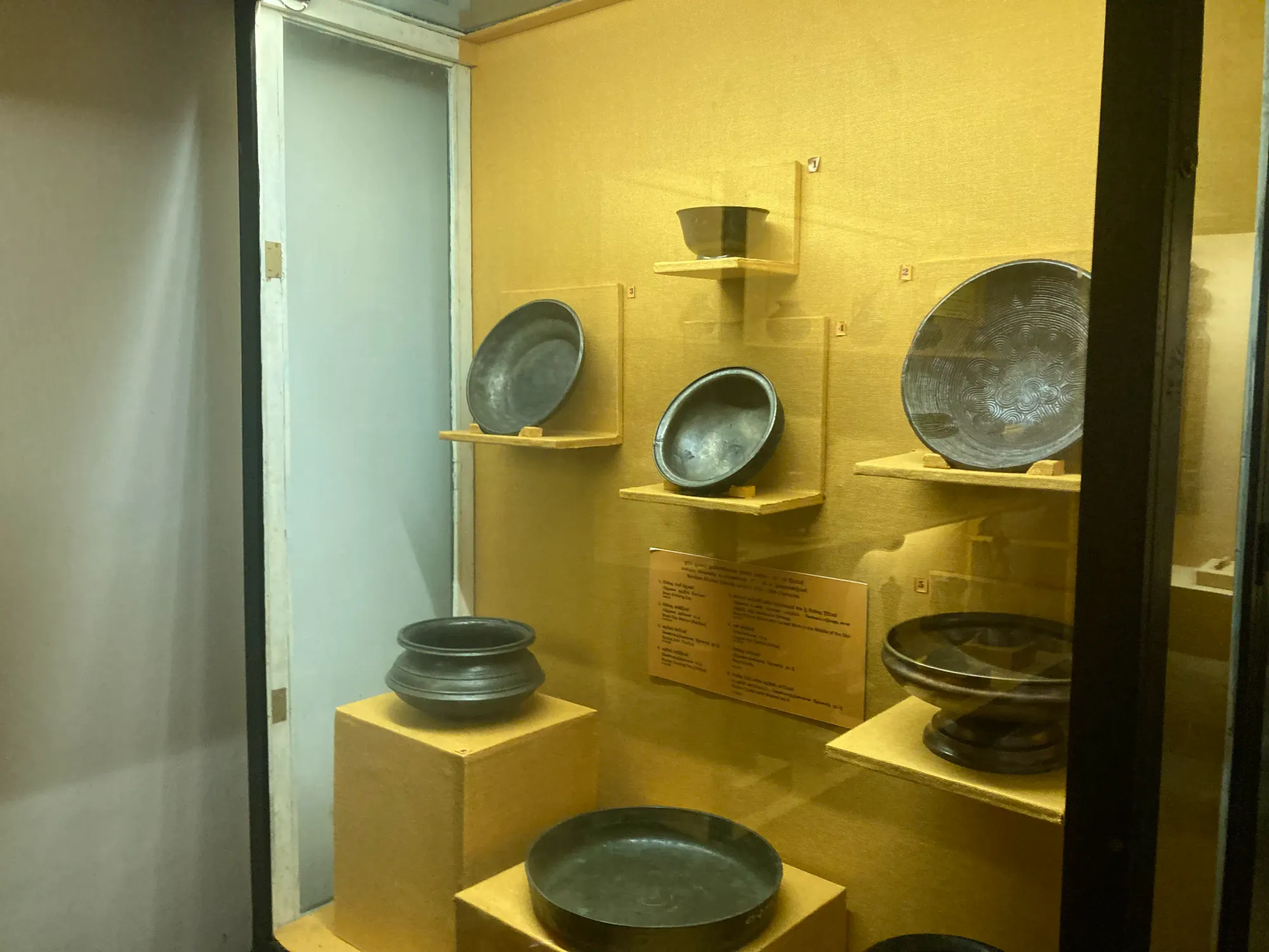 Plates and pots displayed at the Kandy National Museum, Sri Lanka
